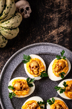 Deviled eggs decorated with skull Halloween food