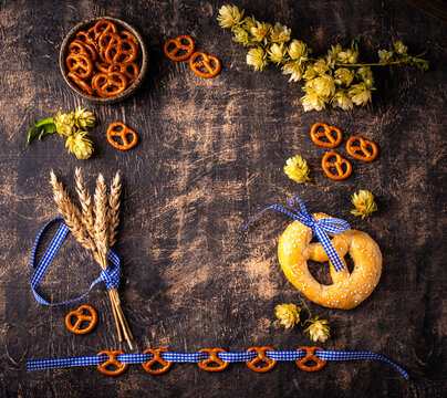 Oktoberfest background with brezel hops and malt with space for text