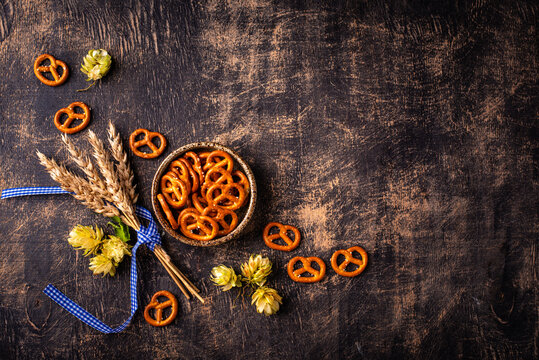 Oktoberfest background with brezel hops and malt with space for text