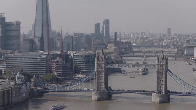 Establishing aerial view of Tower Bridge and The Shard in London. Iconic landmarks in the capital of the United Kingdom