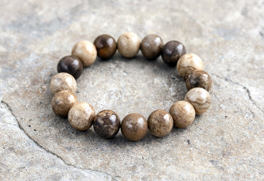 Handcrafted natural stone bead bracelet with earthy tones and polished finish for bohemian jewelry lovers