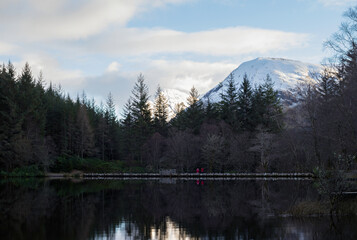 View over Glencoe Lochan toward pointy Aonach Dubh a' Ghlinne and bulky Meall Mor. Glencoe village, Lochaber, Highlands of Scotland. © David
