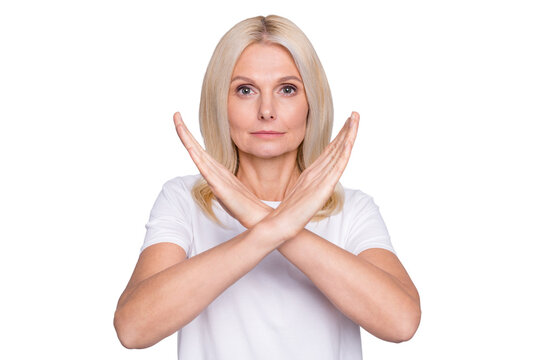 Photo portrait of old lady showing crossed hands telling you to stop isolated on grey colored background
