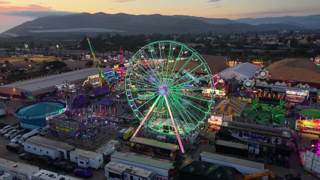 CALIFORNIA - 9.2.2026 - Excellent aerial panorama of the Ventura County Fair's carnival rides at sunset.