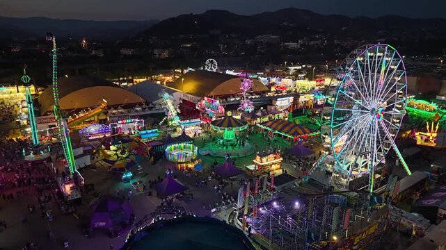 CALIFORNIA - 9.2.2026 - Fantastic aerial view of dizzying carnival rides at the Ventura County Fair at night.