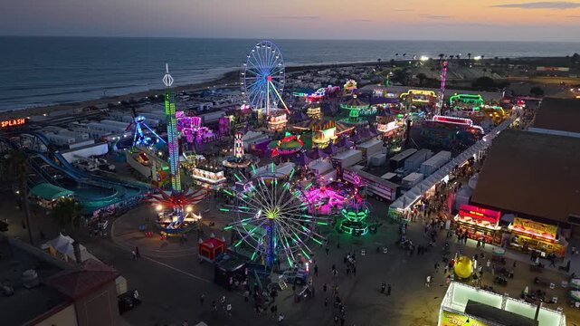 CALIFORNIA - 9.2.2026 - Terrific aerial view of the beachfront Ventura County Fair's carnival rides at sunset.