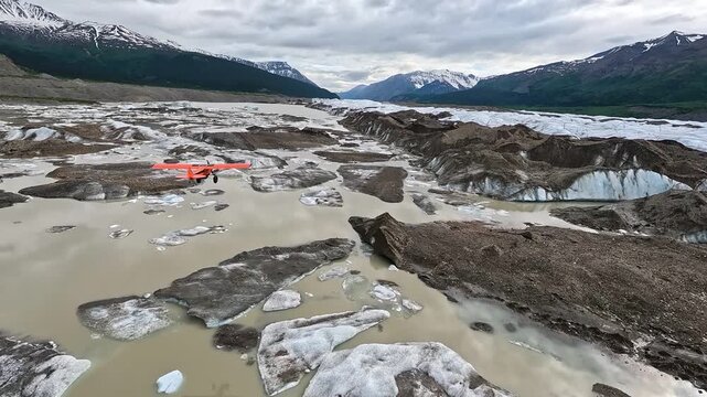 ALASKA - 9.3.2026 - Terrific aerial footage following a bush pilot flying low over Alaska's Little Bremner River, towards snow-capped mountains.