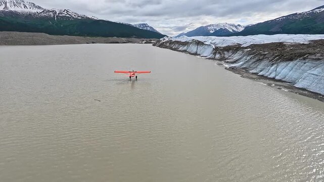 ALASKA - 9.3.2026 - Beautiful aerial footage following a bush pilot skimming Alaska's Little Bremner River, headed towards snow-capped mountains.