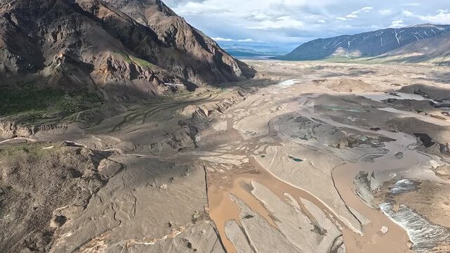 ALASKA - 9.3.2026 - Very good aerial footage following a bush pilot flying over an arid Alaskan valley.