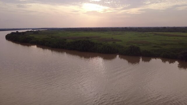 GAMBIA - 12.19.2025 - Beautiful aerial footage of the Gambia River moving towards the sunset.