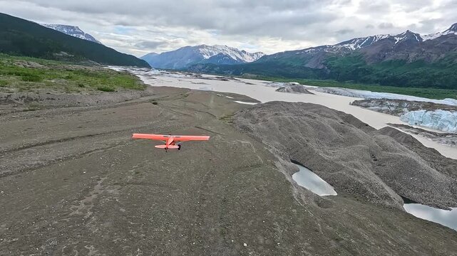 ALASKA - 9.3.2026 - Great aerial footage following a bush pilot flying over Alaska's Tebay Lakes towards snow-capped mountains.