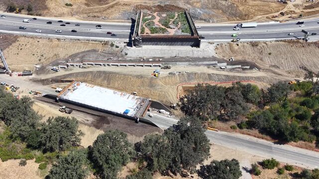 CALIFORNIA - 9.22.2026 - Great aerial tilt up the construction site of the Wallis Annenberg Wildlife Crossing, which is being built over California's Highway 101.