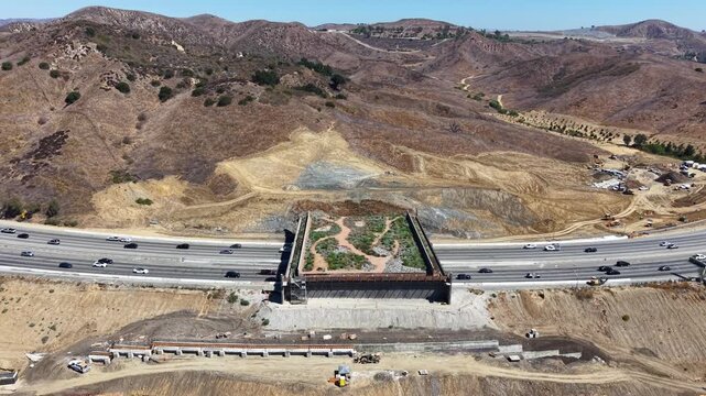 CALIFORNIA - 9.22.2026 - Terrific aerial footage approaching the Wallis Annenberg Wildlife Crossing construction site from the side of California's Highway 101.