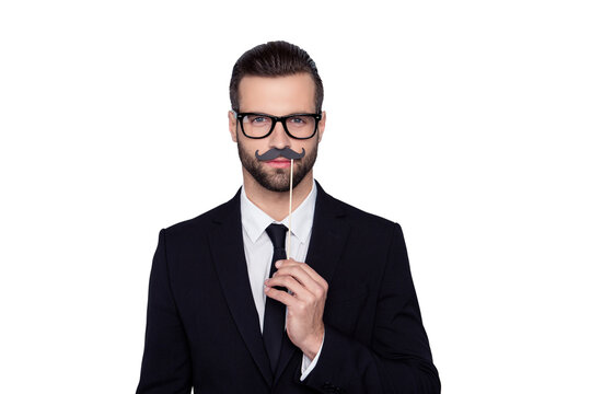 Portrait of confident attractive handsome executive concentrated hypocrite creative smart intelligent cunning tricky employer with false black mustache isolated on gray background