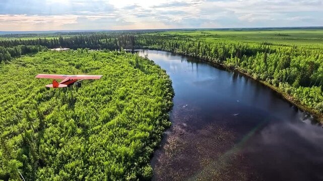 ALASKA - 9.3.2026 - Stunning aerial footage of bush pilots flying small aircrafts over green forests and wetlands in Alaska.