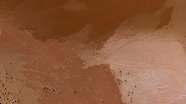 Aerial view of intricate sand patterns and desert textures across the arid landscape of Kalbarri, Western Australia, Australia.