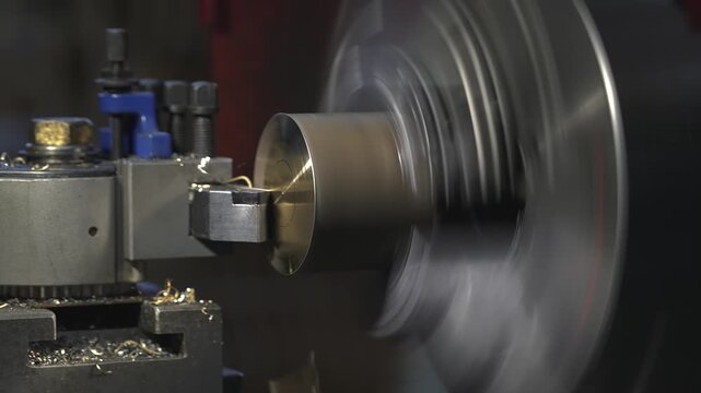 the process of manufacturing a metal part from a brass blank on a CNC lathe using drills and cutting tools