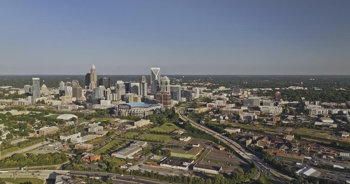 Charlotte North Carolina Aerial v145 flyover Third ward capturing the freeway leading to city center, South End and downtown cityscape against cloudless sky - Shot with 5k Camera - Oct 1st 2023