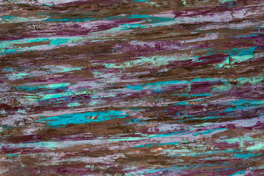 Weathered wood shows vibrant turquoise and purple streaks. Rich textures suggest age and outdoor exposure. Abstract pattern evokes mystery and organic decay