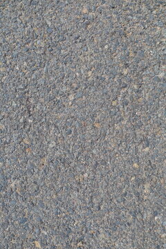 Top view coarse gray asphalt pavement texture, road construction, infrastructure background design, and transportation projects