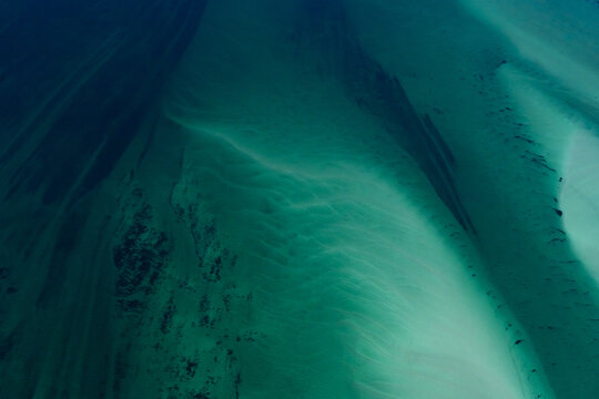 Aerial view of the intricate sandbanks and turquoise water currents of Shark Bay, showcasing natural ocean patterns in Shire of Shark Bay, Western Australia, Australia.