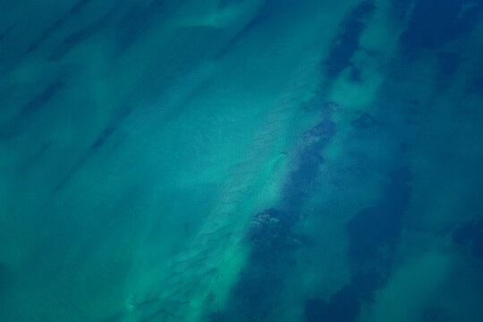 Aerial view of the turquoise ocean patterns and sandbanks in the Shire of Shark Bay, Western Australia, Australia.