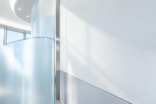 Modern Medical Clinic Interior Wall with Frosted Glass Curved Panel and Metallic Trim