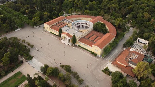 Aerial view of the Zappeion exhibition hall surrounded by lush gardens and trees in Athens, Greece.