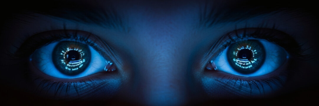 Human eyes reflecting digital data code in intense blue neon light showing futuristic technology surveillance and artificial intelligence vision concepts