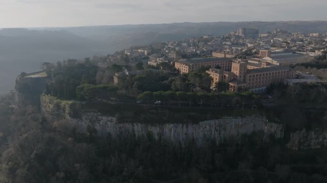 Aerial view of Orvieto Cathedral situated on a volcanic tuff cliff overlooking the valley in Orvieto, Umbria, Italy.