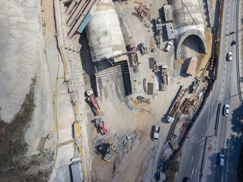 Aerial view of a tunnel construction site featuring heavy machinery, excavators, and concrete tunnel segments under development in Istanbul, Istanbul, Turkiye.