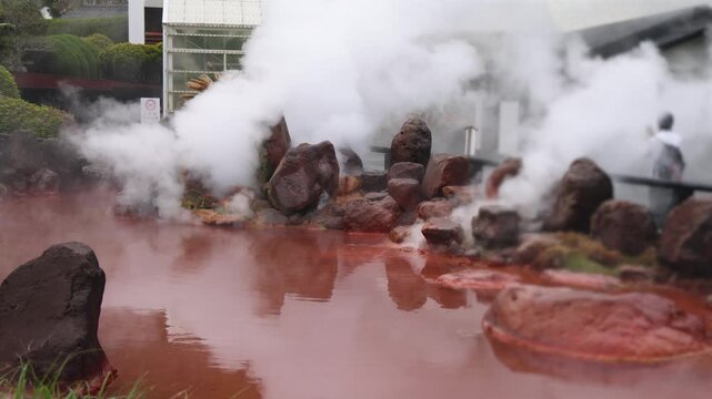 Umi Jigoku, (Sea hell), Kannawa district, Beppu City, Beppu Jigoku, Japan, steaming hot spring pond at Hells of Beppu tour, Oita Prefecture, Kyushu Island, vivid mineral colored geothermal water