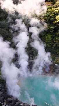 Umi Jigoku, (Sea hell), Kannawa district, Beppu City, Beppu Jigoku, Japan, steaming hot spring pond at Hells of Beppu tour, Oita Prefecture, Kyushu Island, vivid mineral colored geothermal water