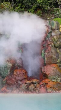 Umi Jigoku, (Sea hell), Kannawa district, Beppu City, Beppu Jigoku, Japan, steaming hot spring pond at Hells of Beppu tour, Oita Prefecture, Kyushu Island, vivid mineral colored geothermal water