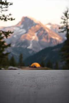 Empty wooden table with a blurred mountain camping view and copy space