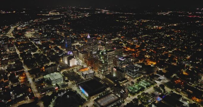 Raleigh North Carolina Aerial v45 high altitude birds eye view, flyover revitalized downtown area capturing illuminated cityscape at night - Shot with 8k Camera - Sept 30th 2023