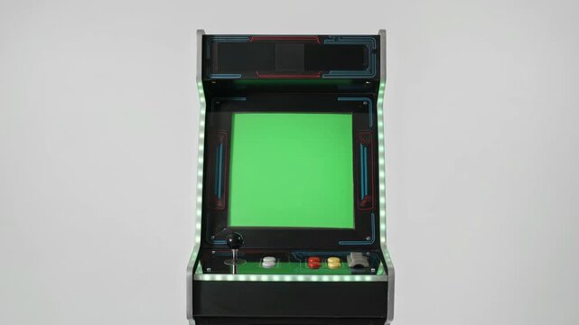 Vintage arcade machine with green screen for motion video editing and classic gaming digital animation project