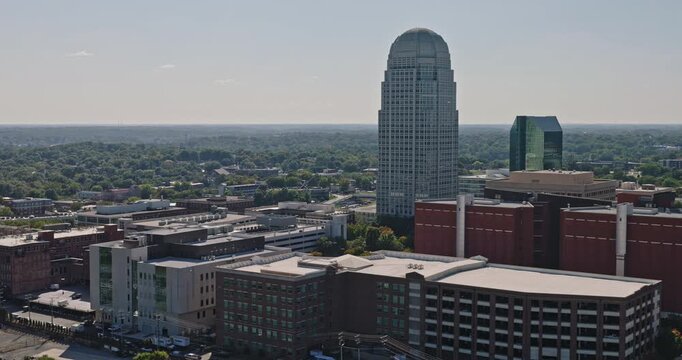 Winston-Salem North Carolina Aerial v7 low tracking flyover across downtown towers, streets and surrounding neighborhoods - Shot with 8k Camera - Oct 1st 2023
