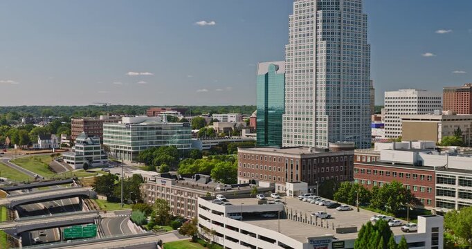 Winston-Salem North Carolina Aerial v6 low tracking flyover past downtown offices and the distinctive city skyline on a clear day - Shot with 8k Camera - Oct 1st 2023