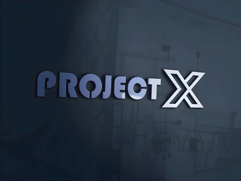 A text logo mounted on the interior wall of an office, set against a dark and dimly lit background.