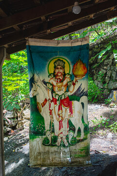 Traditional banner depicting local deity Suniyam Deviyo with a white horse and cobras at a shrine in Unawatuna, Sri Lanka