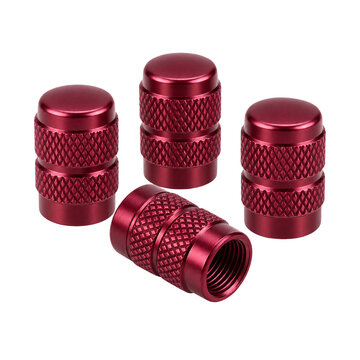 Set of four red aluminum tire valve stem caps with a knurled texture