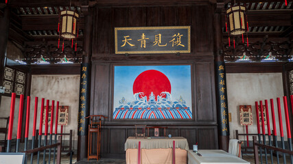 Interior of ancient Linan Prefecture yamen in Jianshui, Yunnan, China, ancient Chinese government courtroom with plaque and mural © Deng Xuejun