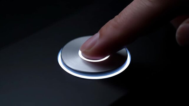 Close-up of a circular button with a blue halo, finger pressing the circular button