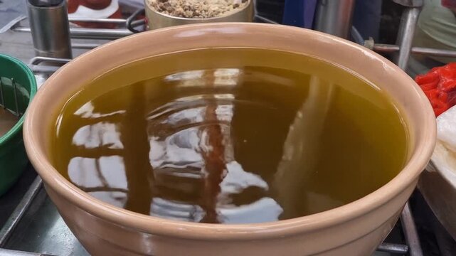 Brine rippling in a ceramic bowl