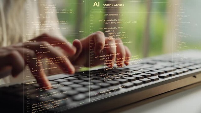Hands type on a keyboard. Agentic software development combines shared context with assigned responsibilities, allowing specialized AI agents to contribute to a coordinated coding task.