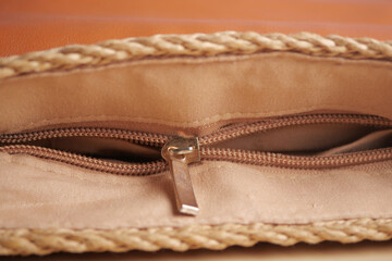 A close view of a broken zipper of a woman purse. © Towfiqu Barbhuiya 