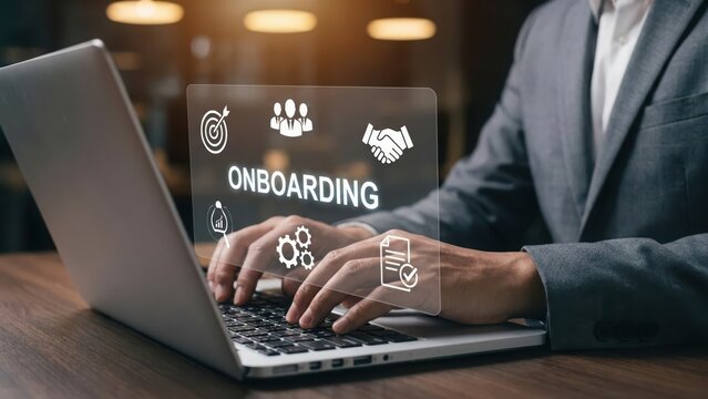 Businessman using laptop with digital onboarding interface for corporate employee integration and human resources management concept
