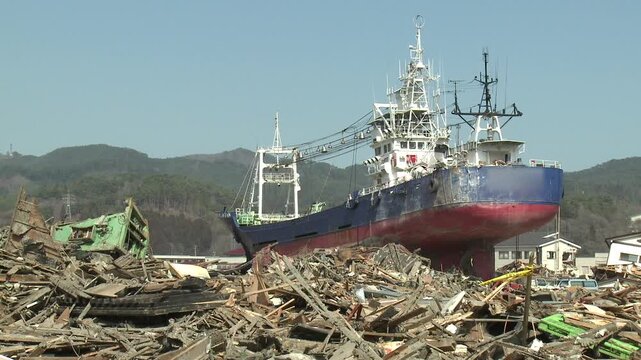 Large Ship Washed Ashore And Surrounded By Debris In Aftermath Of Tsunami In Japan
