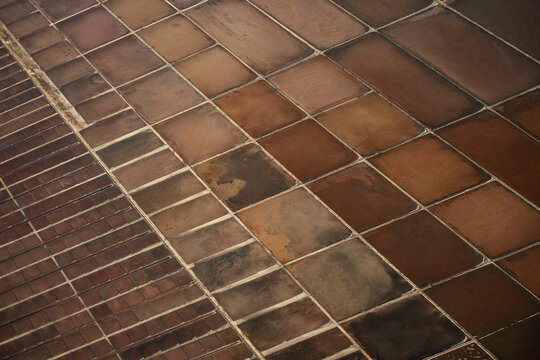 Aerial view of salt evaporation ponds with rectangular grid patterns and varying earth tones in Rio de Janeiro, Rio de Janeiro, Brazil.